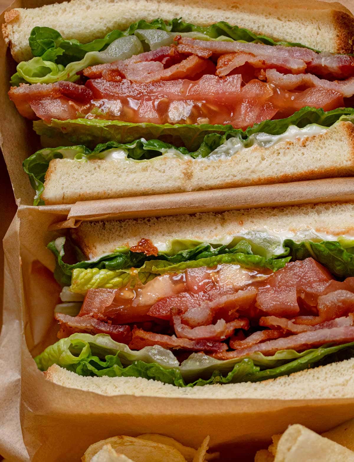 close-up of BLT Sandwich sliced in half