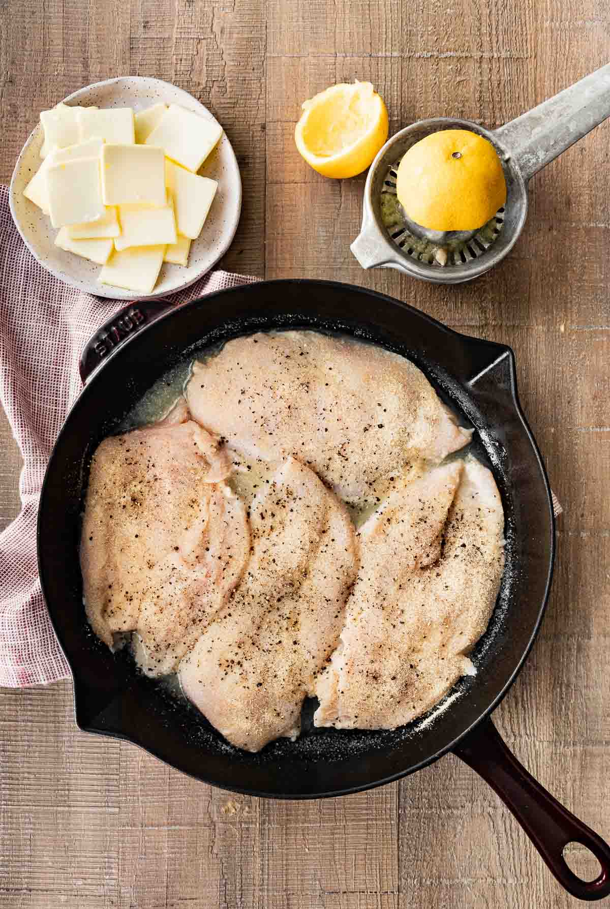 Buttery Lemon Garlic Baked Chicken in pan