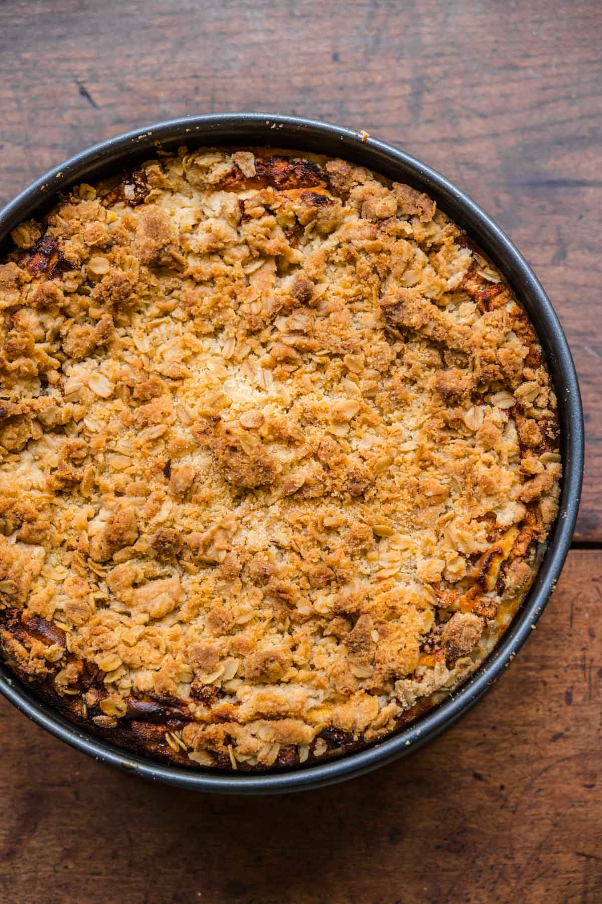 Caramel Apple Crumb Cheesecake in pan after baking