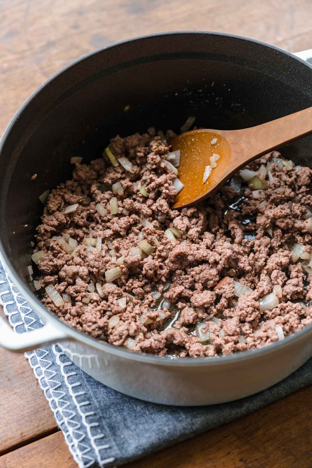 Ground beef and onions in pan for Cheeseburger Pasta