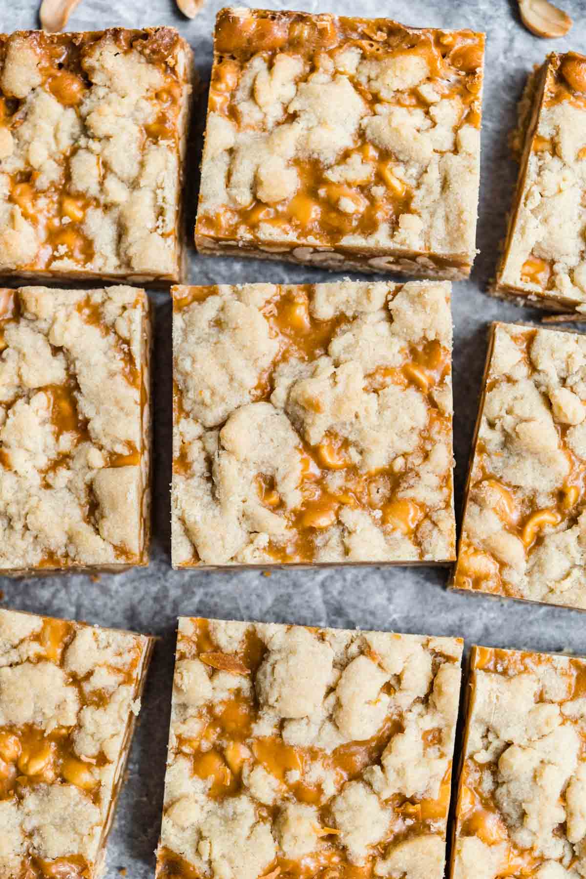 Chewy Peanut Shortbread Bars squares cut on parchment