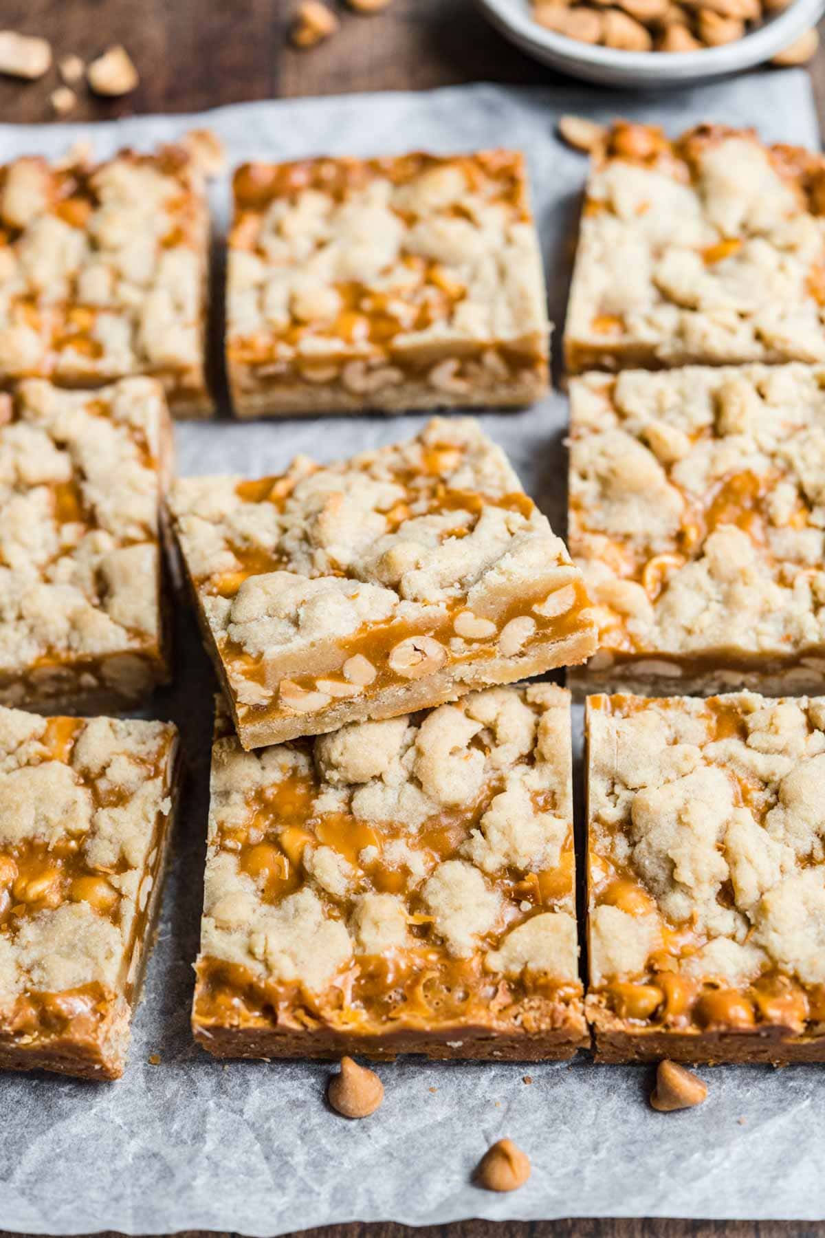 Chewy Peanut Shortbread Bars squares cut on parchment