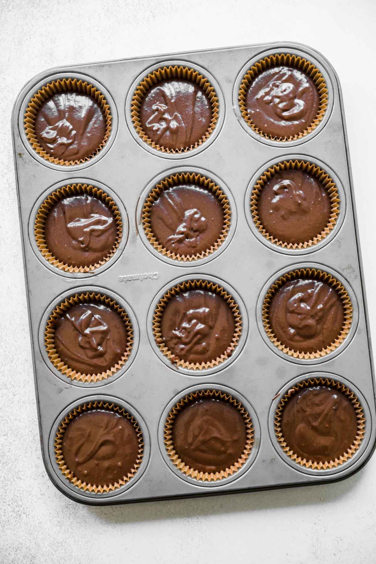 Dark Chocolate Cupcakes batter in cupcake tin