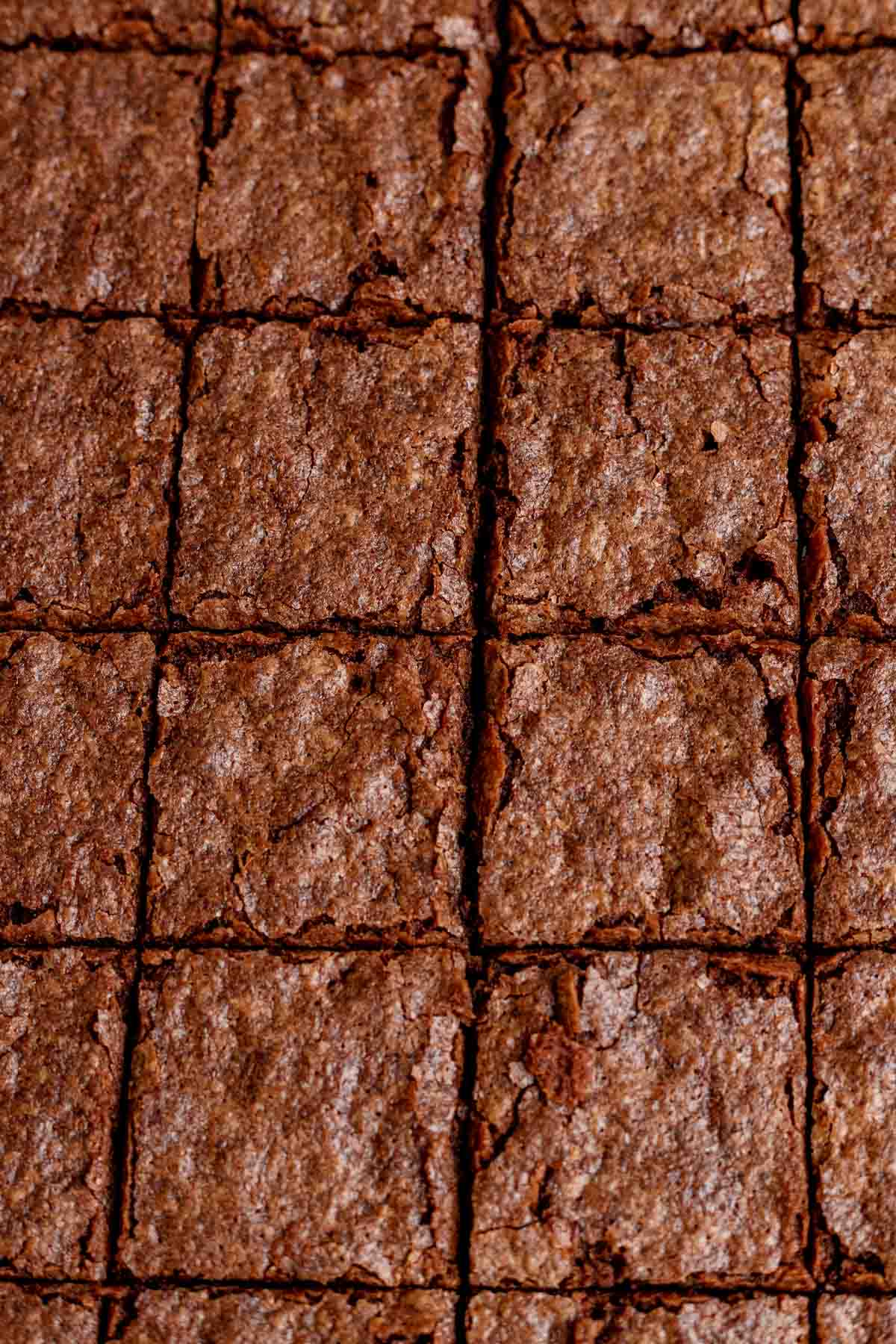 Fudgy Brownies sliced on parchment