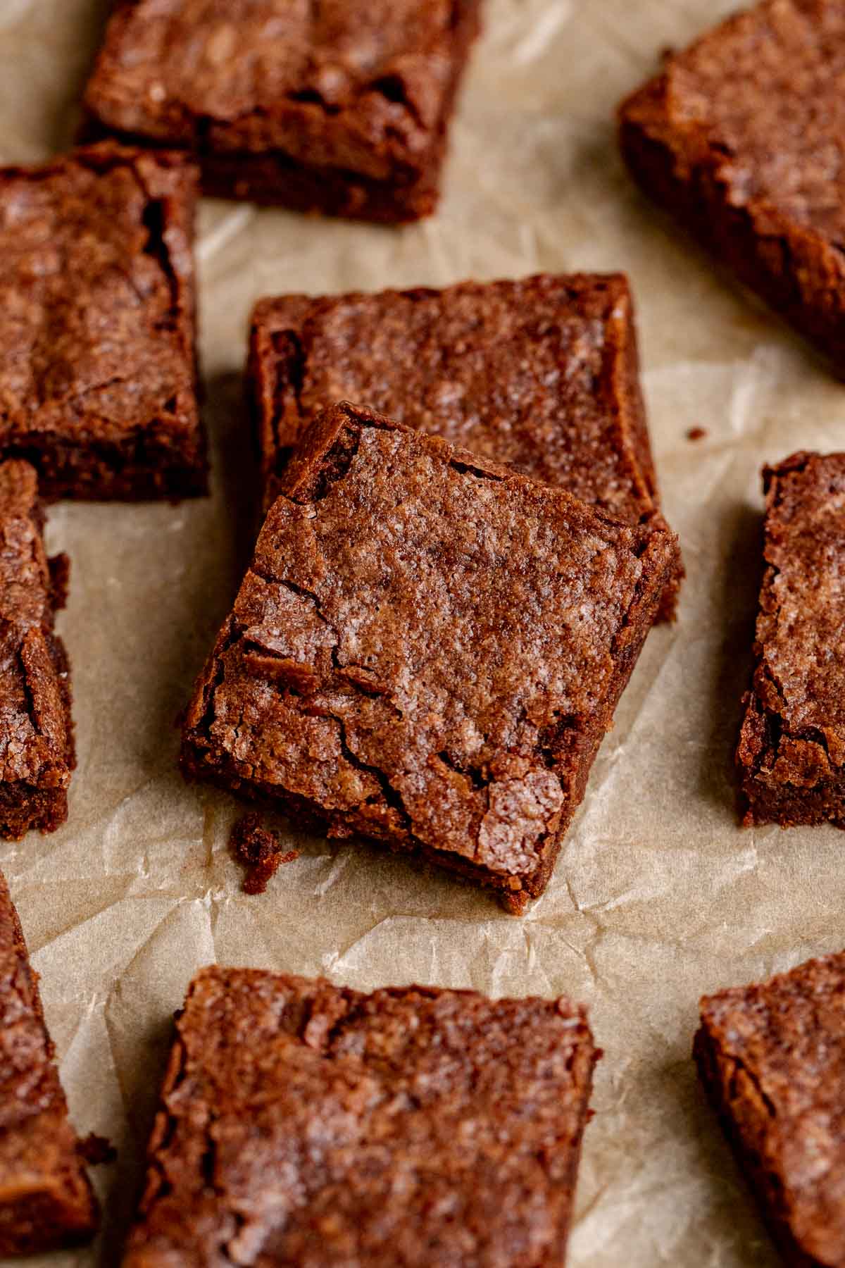 Fudgy Brownies sliced on parchment