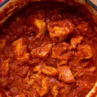 Chicken in rich tomato sauce in a pot