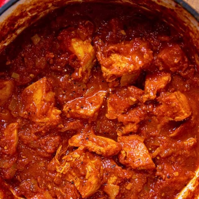 Chicken in rich tomato sauce in a pot