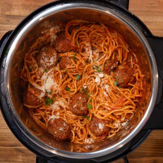 Instant Pot Spaghetti and Meatballs in pressure cooker with parmesan cheese
