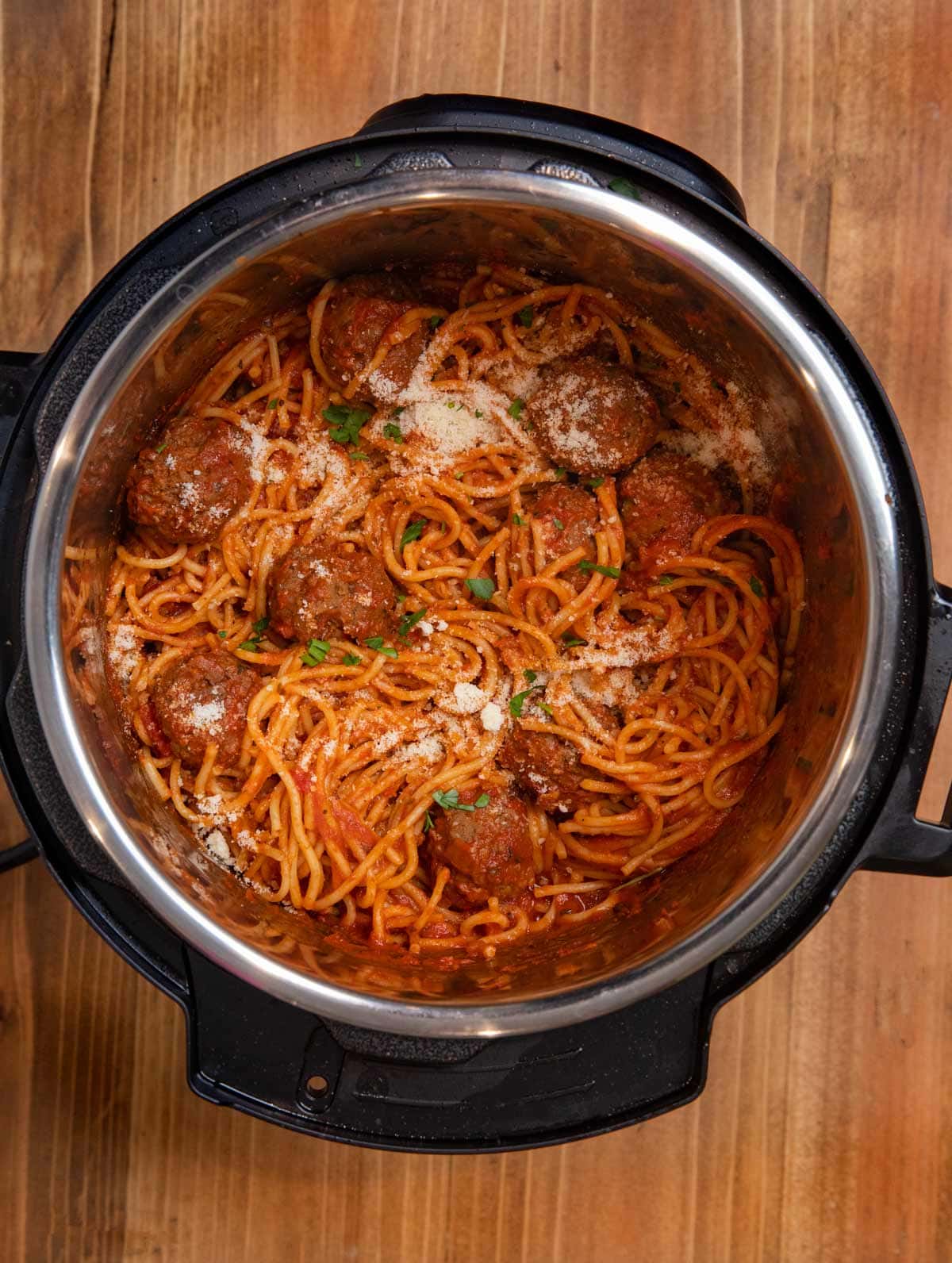 Instant Pot Spaghetti and Meatballs in pressure cooker with parmesan cheese