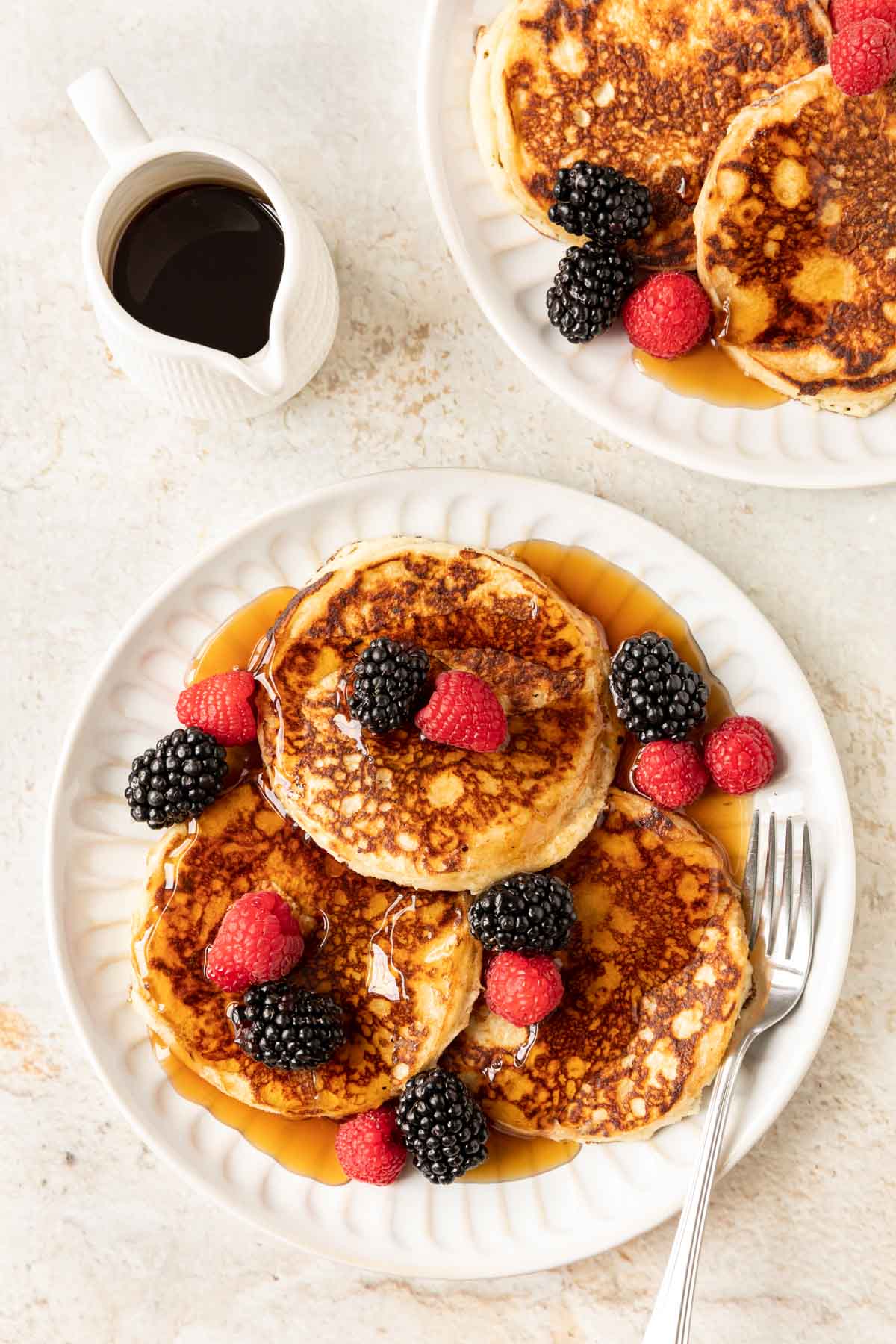 Overnight Pancakes ingredientsOvernight Pancakes ingredientsOvernight Pancakes stacked with fresh berries and maple syrup