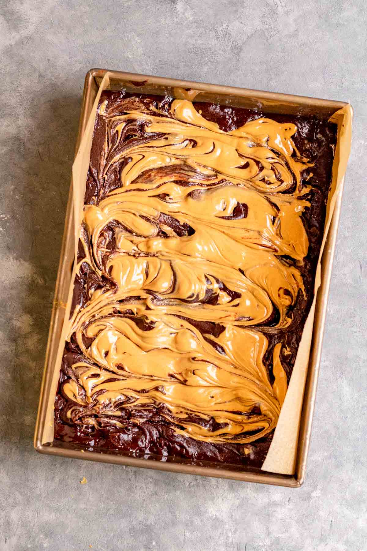 Peanut Butter Swirl Brownies batter with peanut butter before baking