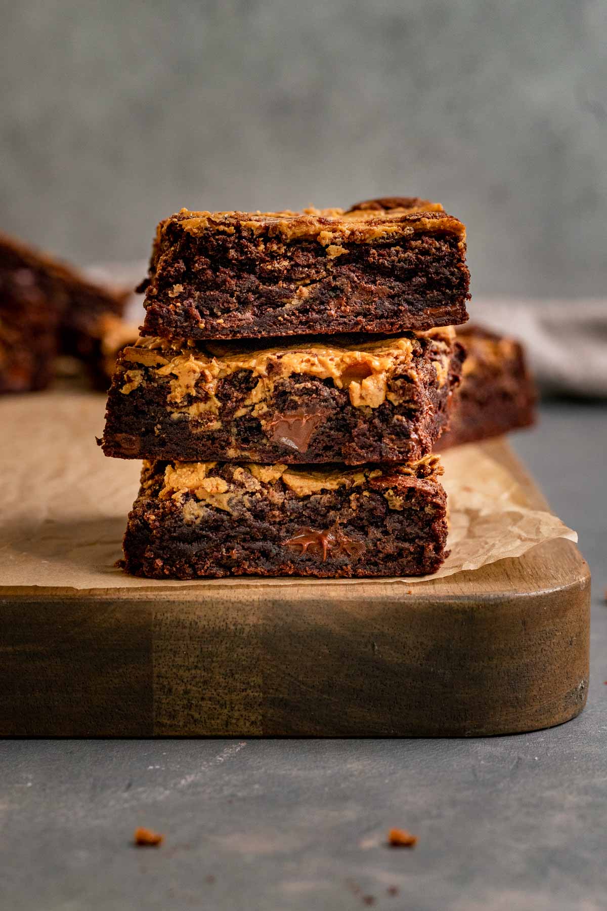 Peanut Butter Swirl Brownies sliced and stacked on cutting board