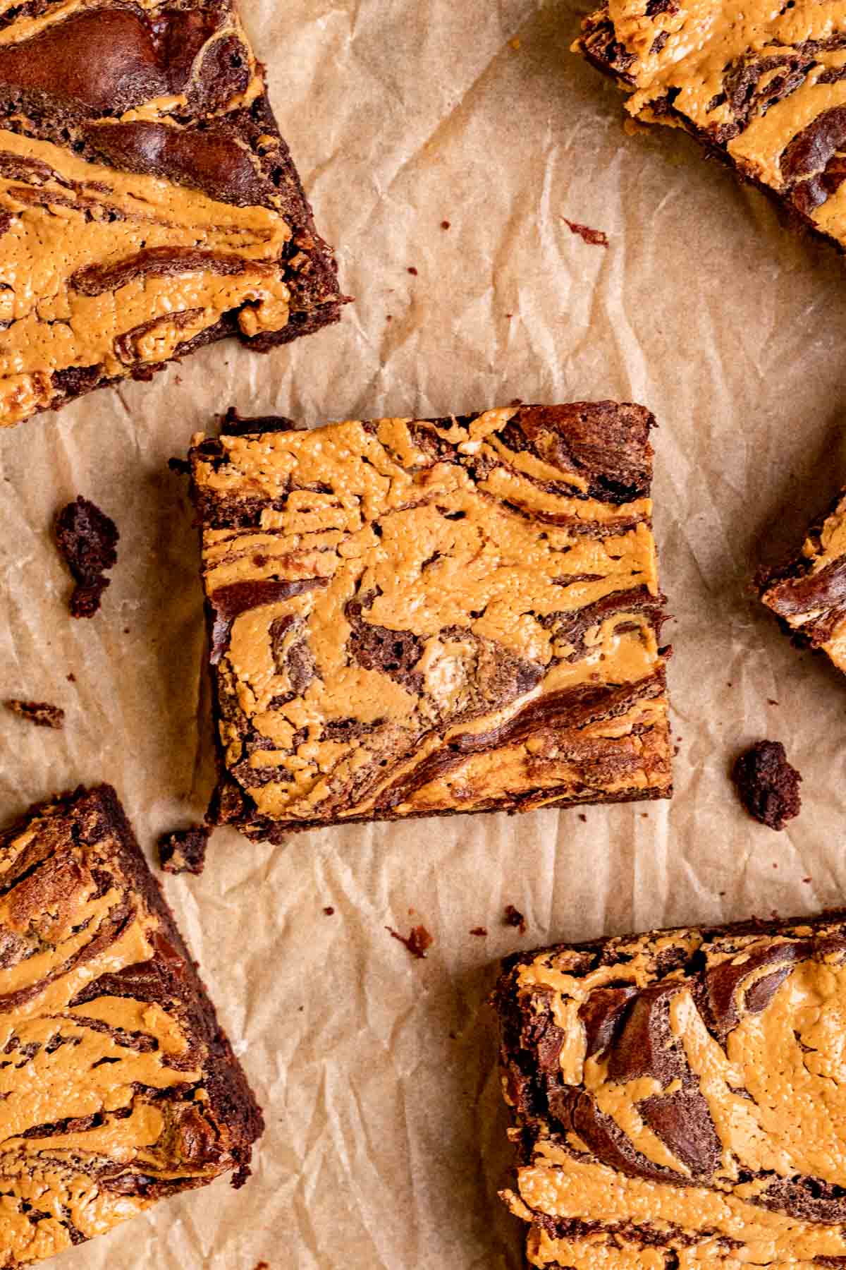 Peanut Butter Swirl Brownies sliced on parchment