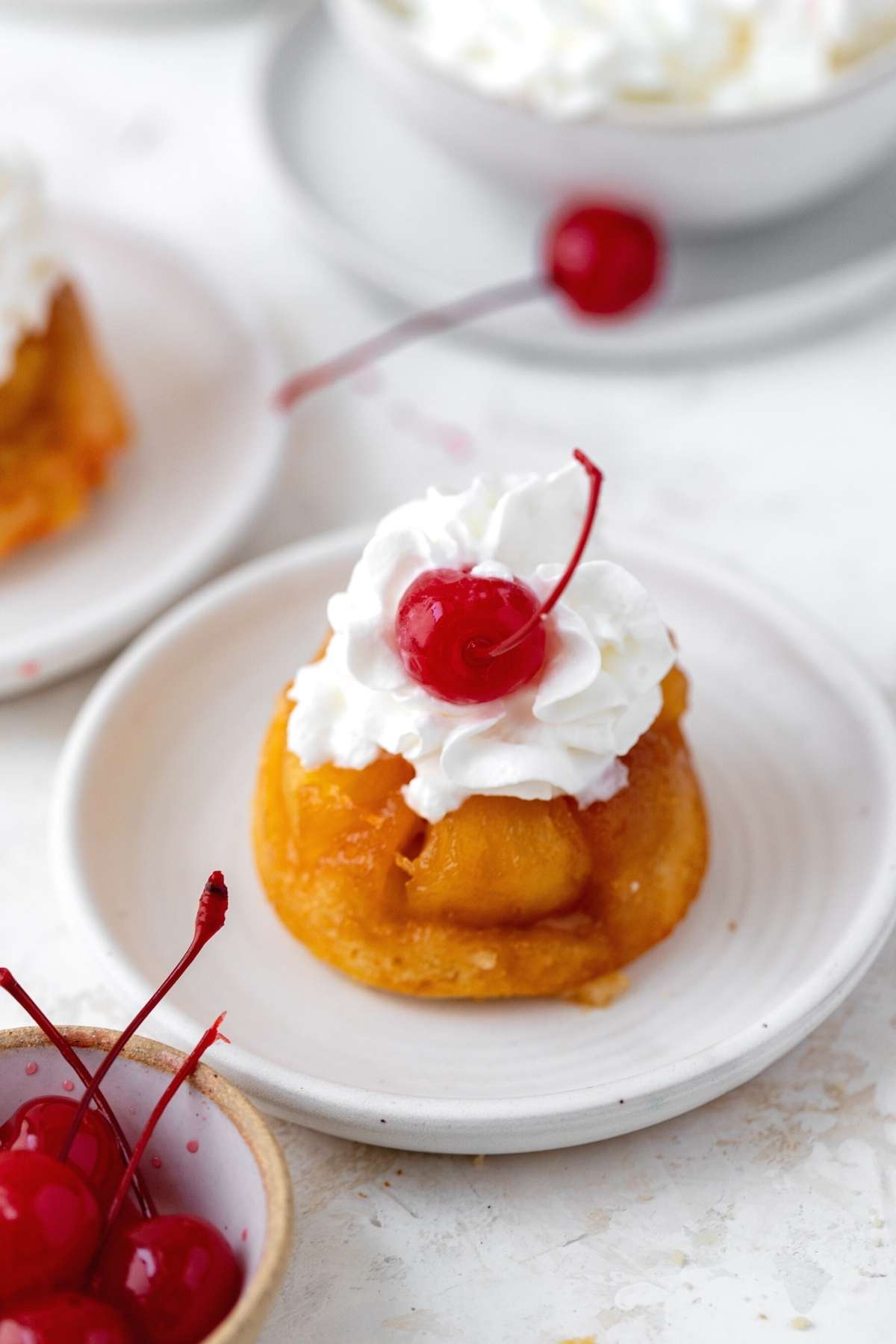 Pineapple Upside Down Cupcakes on serving plate