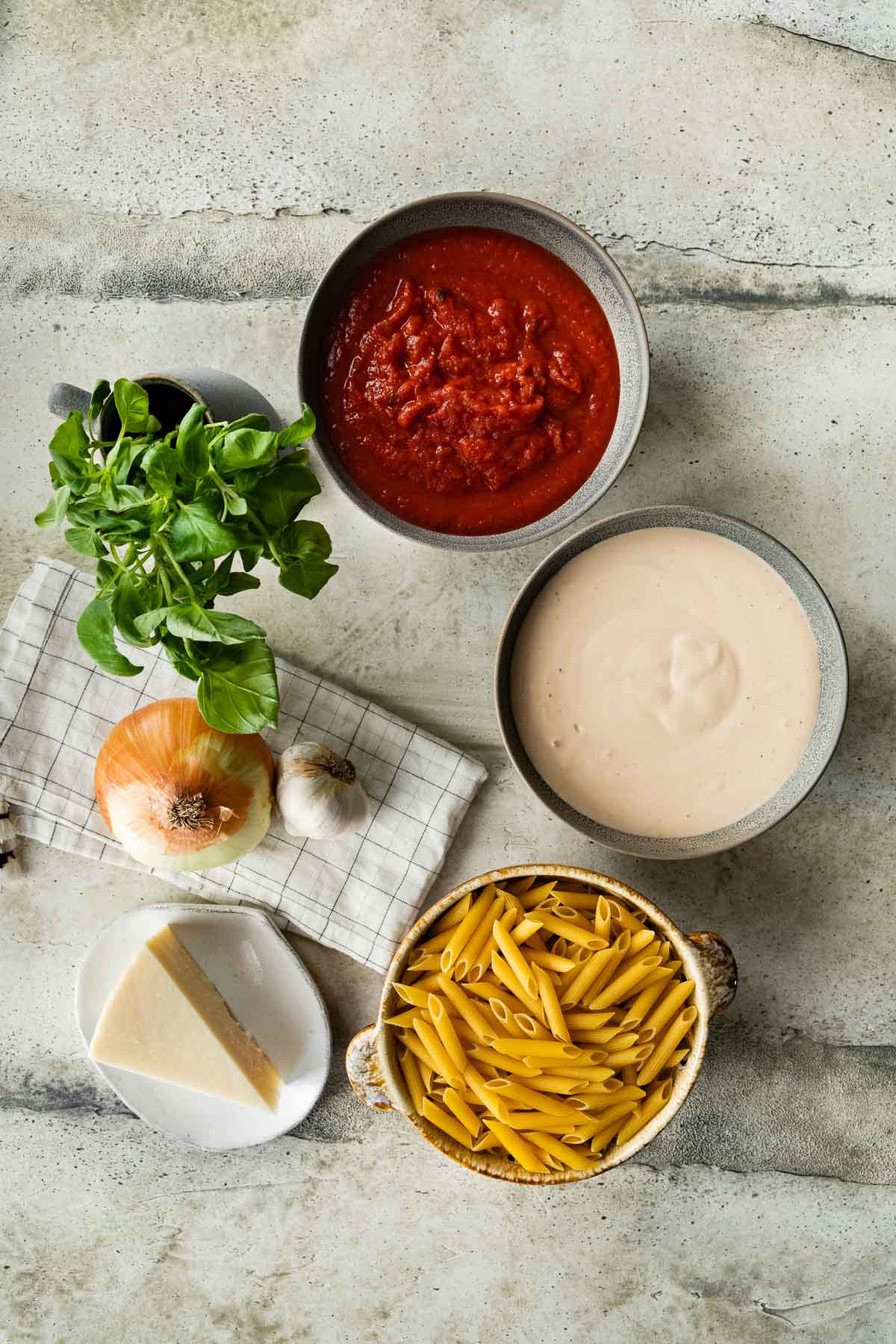 Ingredients for Pink Sauce Pasta in prep bowls