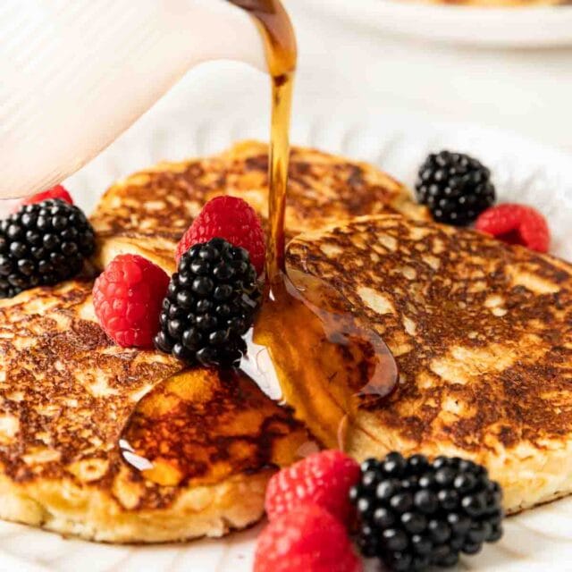 Overnight Pancakes ingredientsOvernight Pancakes ingredientsOvernight Pancakes stacked with fresh berries and maple syrup