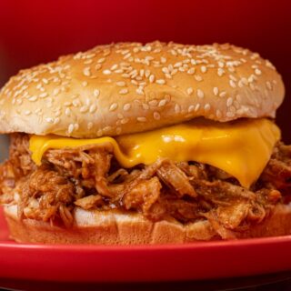 Shredded chicken and cheese in a sandwich 4x3