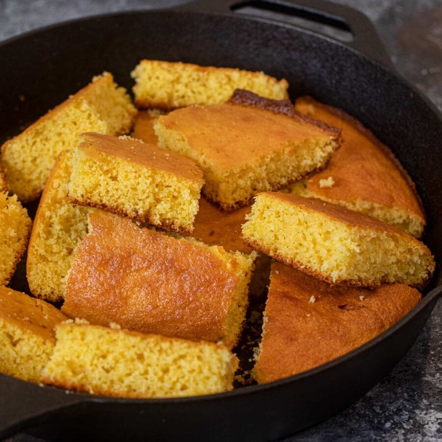 Skillet Cornbread sliced squares in cast iron skillet