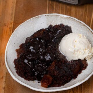 Slow Cooker Lava Cake in bowl with vanilla ice cream