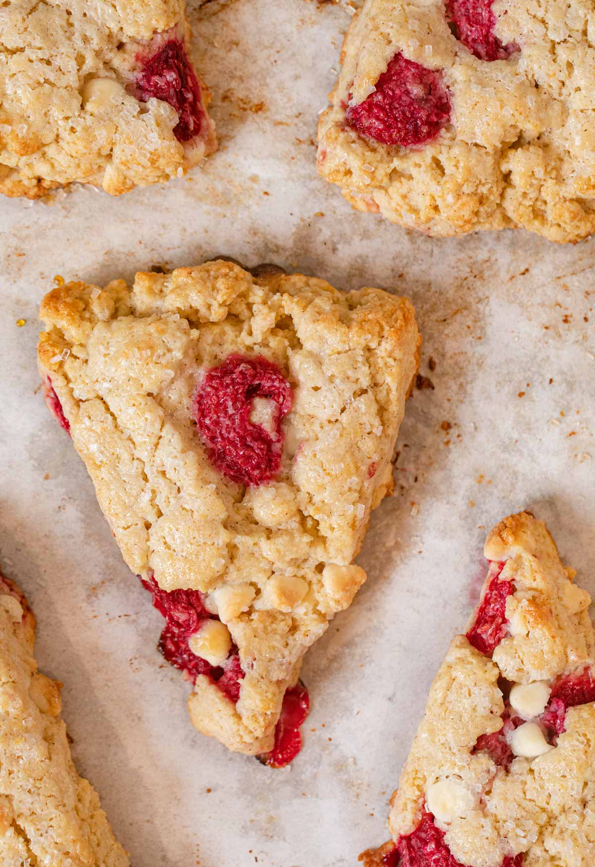 close-up of White Chocolate Raspberry Scones on cookie sheet