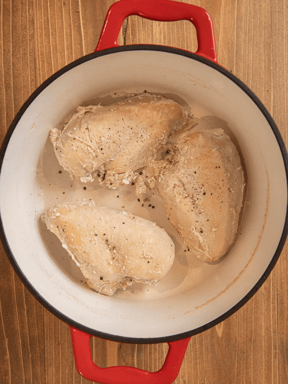Three chicken breasts in Dutch oven