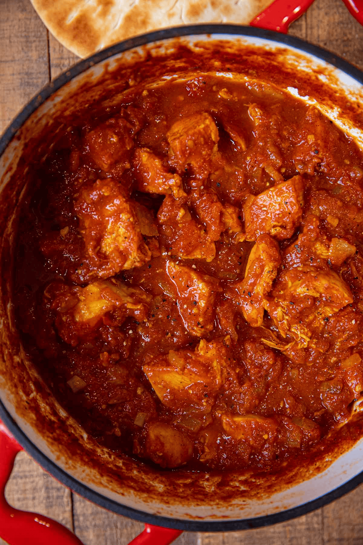 Chicken and tomato sauce in a Dutch oven