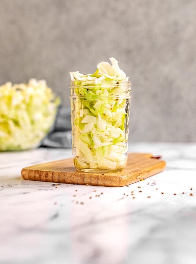Amish Vinegar Slaw in a jar on cutting board