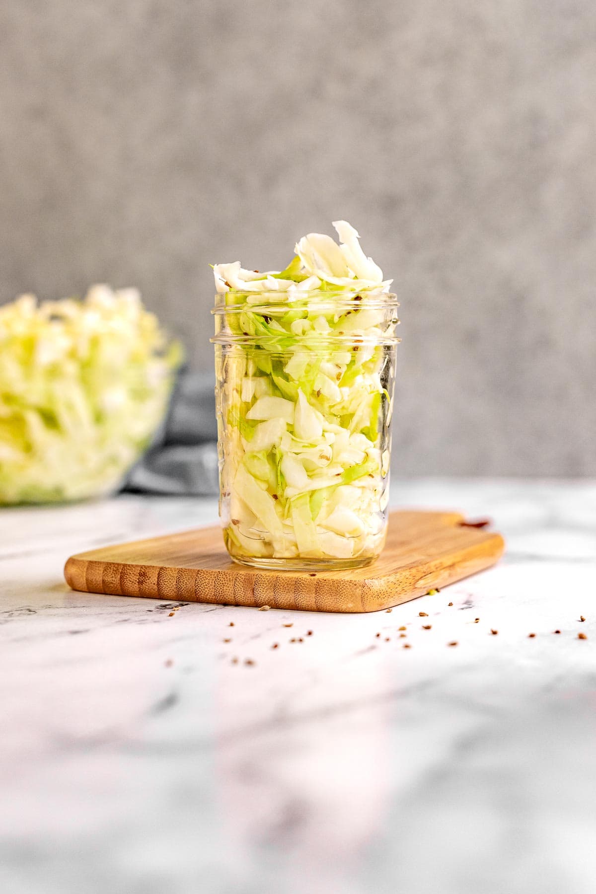 Amish Vinegar Slaw in a jar on cutting board