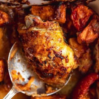 chicken and sweet potatoes on a serving spoon.
