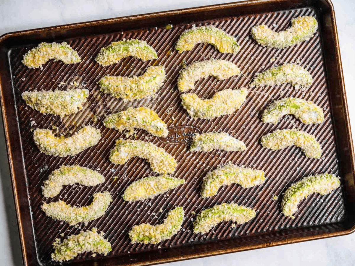 avocado prepped on sheet pan
