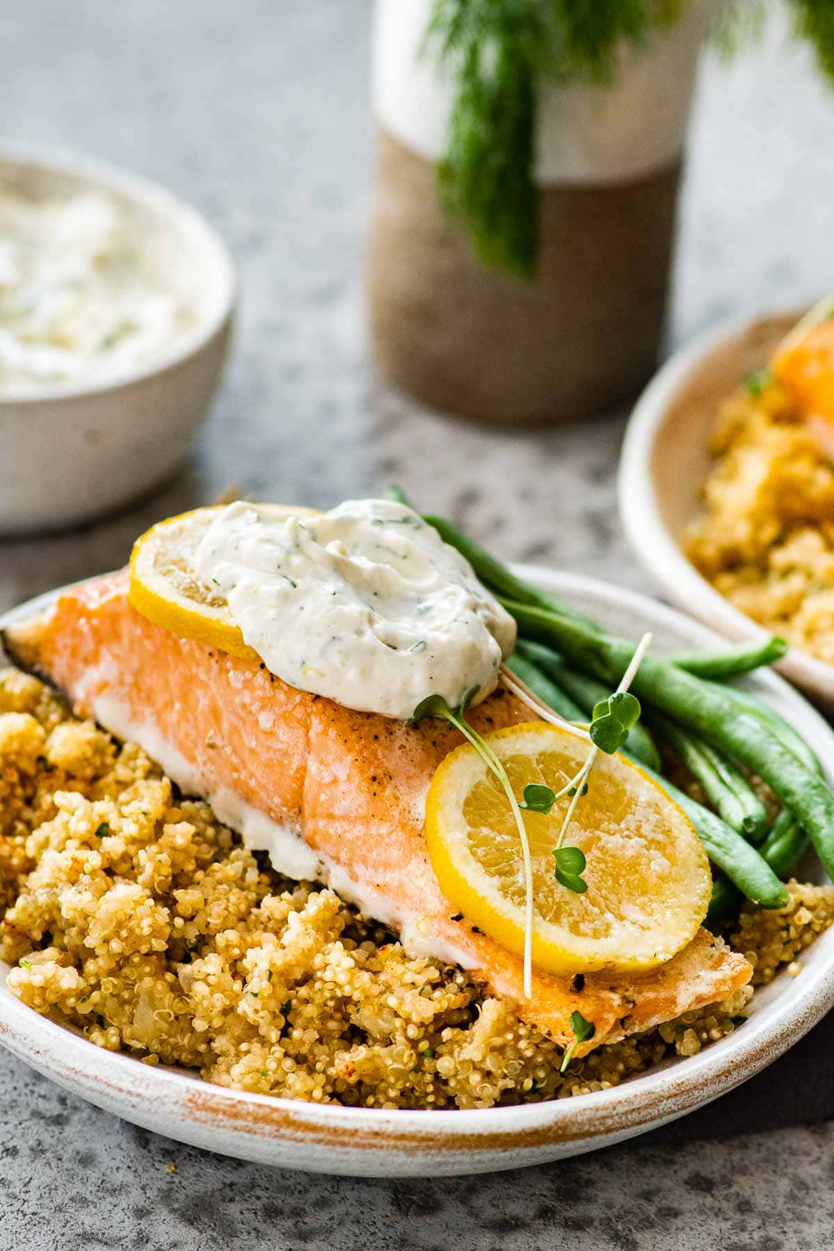 Baked Salmon with Dill Sauce served with quinoa and green beans