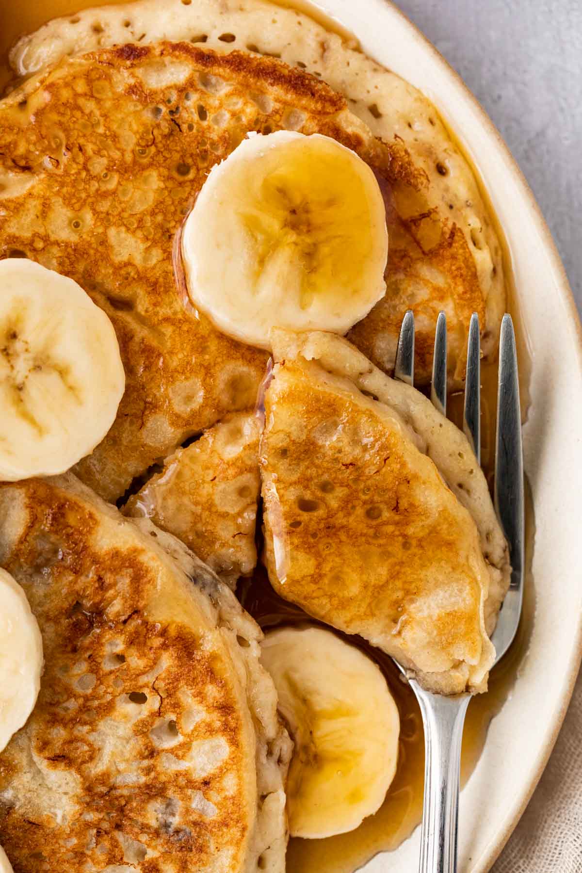 Banana Pancakes pancakes cut on serving plate