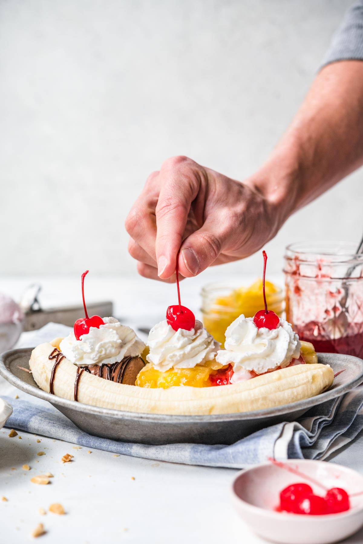 Banana Split on plate with chocolate, pineapple, and strawberry topping