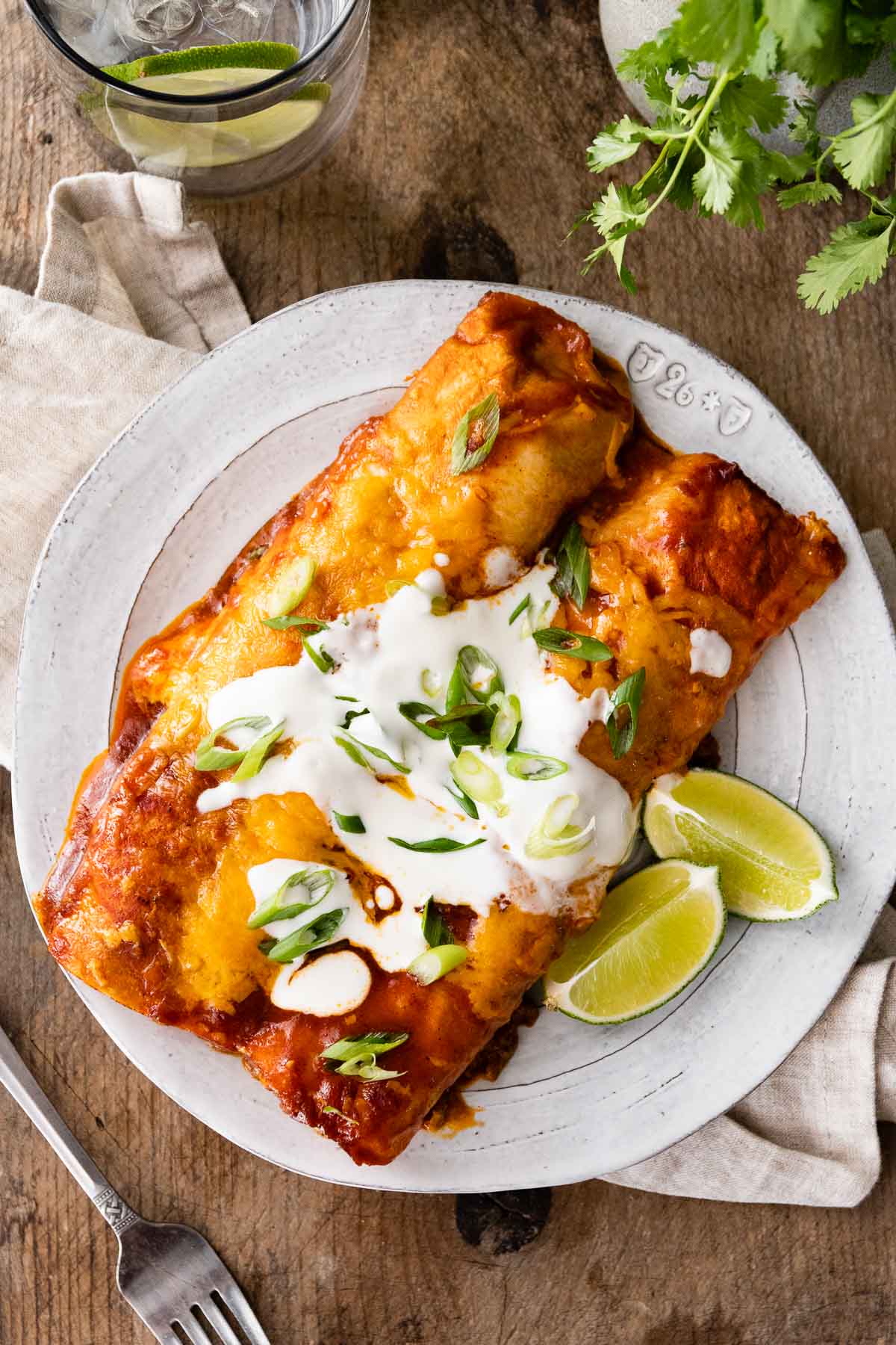 Beef Enchiladas on plate with lime wedges