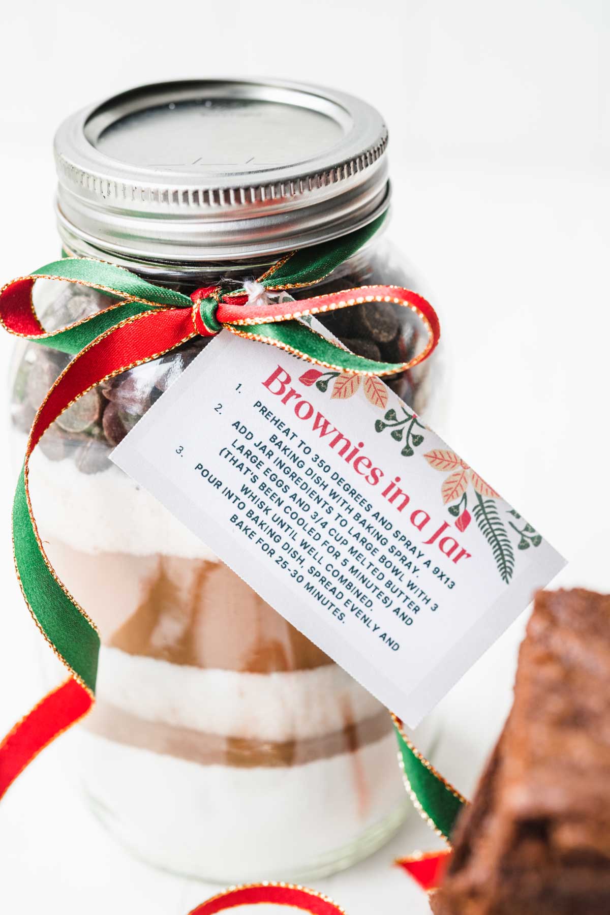 Brownies in a Jar with layered ingredients and gift tag