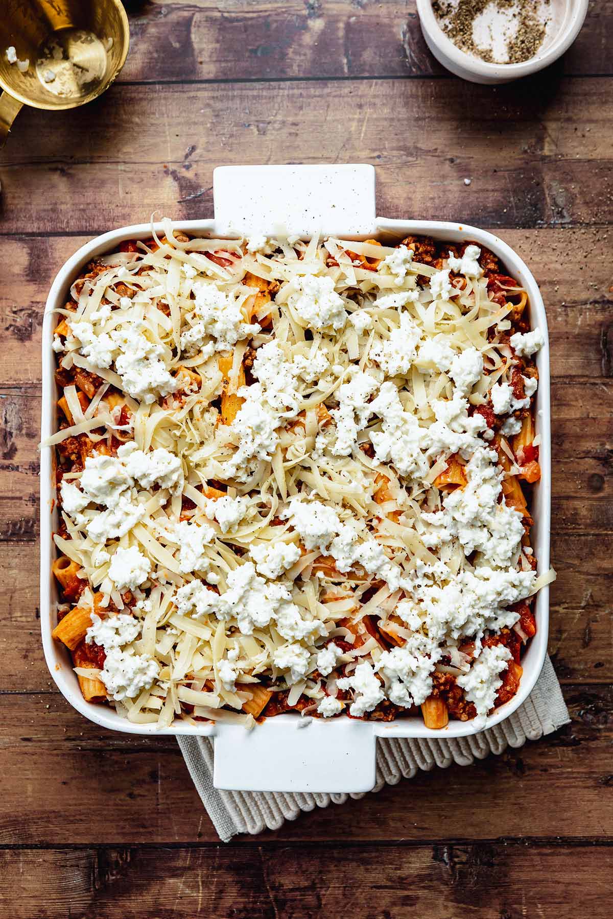 Cheesy Beef Pasta Bake in baking dish before baking