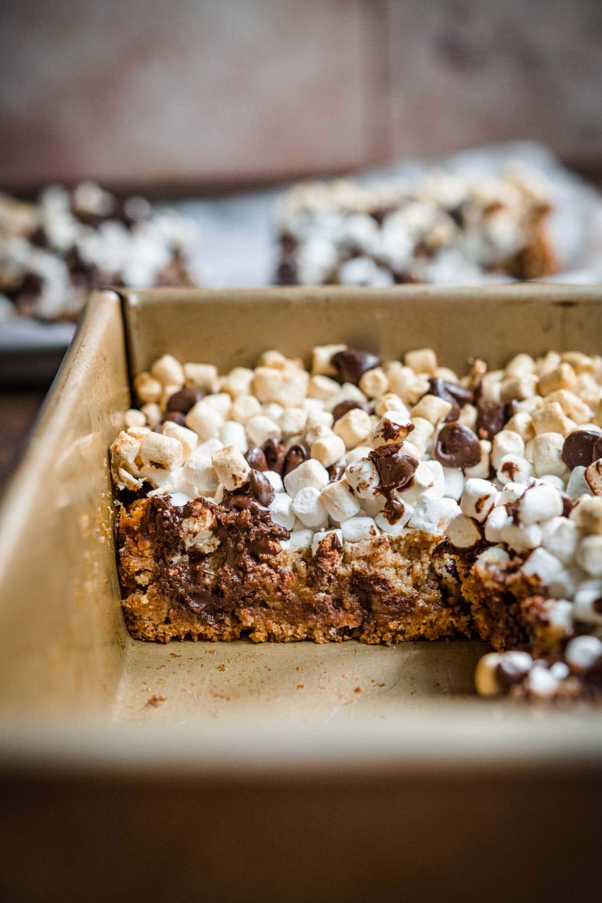 Chewy S'mores Magic Bars sliced in baking pan