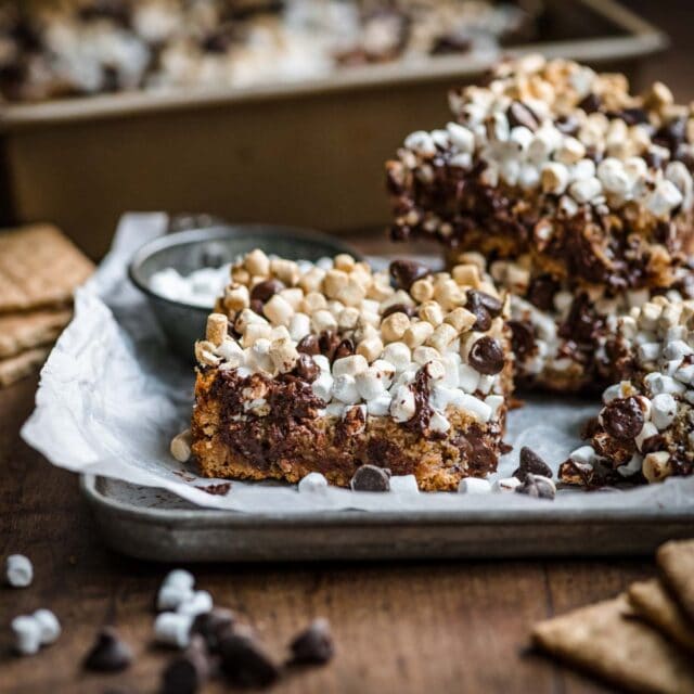Chewy S'mores Magic Bars on serving plate 1x1