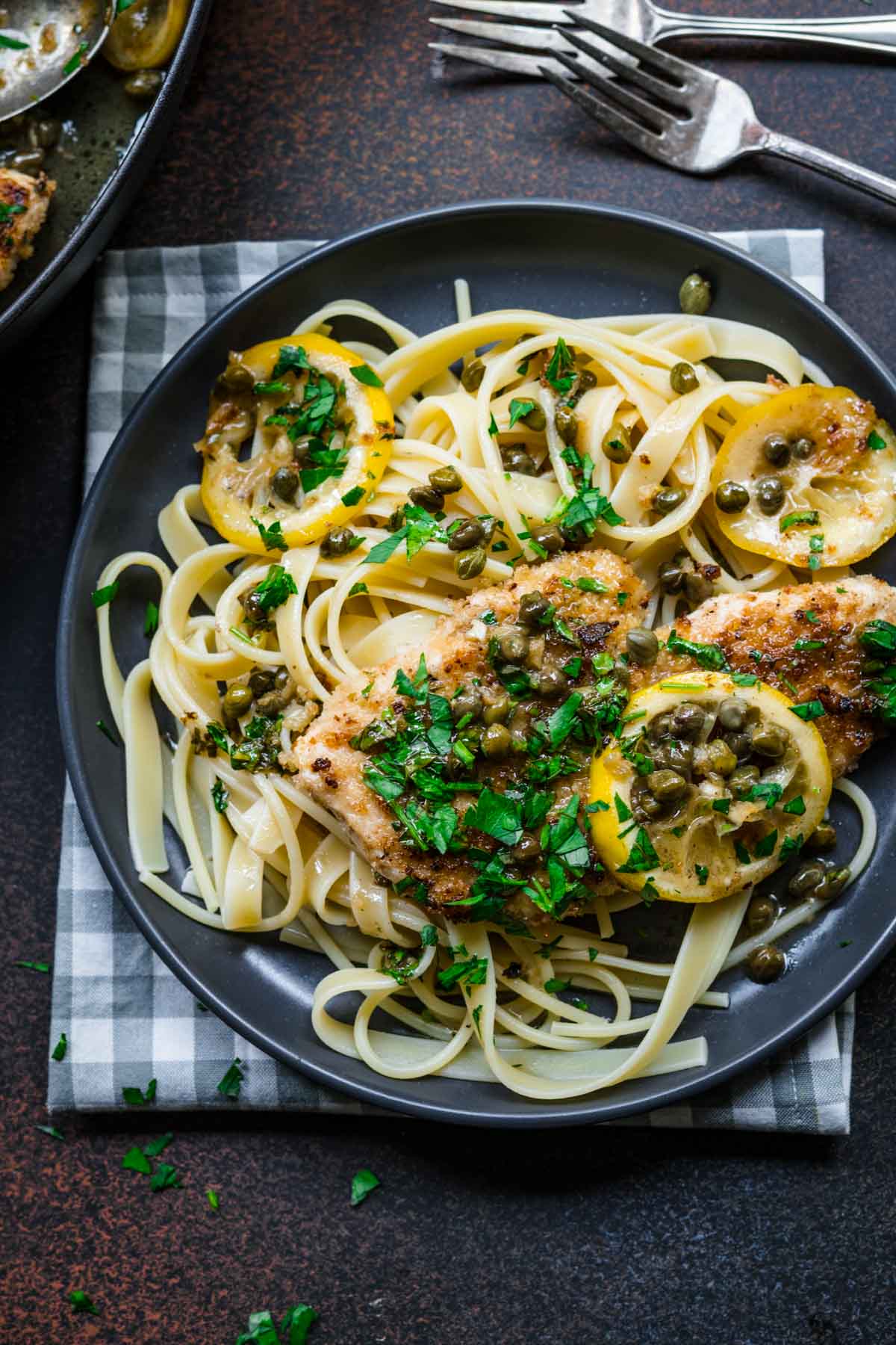 Chicken Piccata on plate with pasta