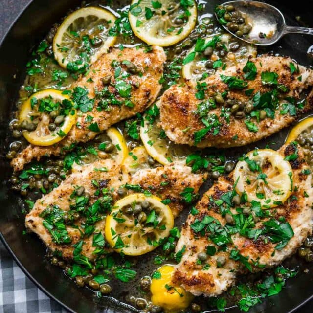 Chicken Piccata in pan with lemon and parsley