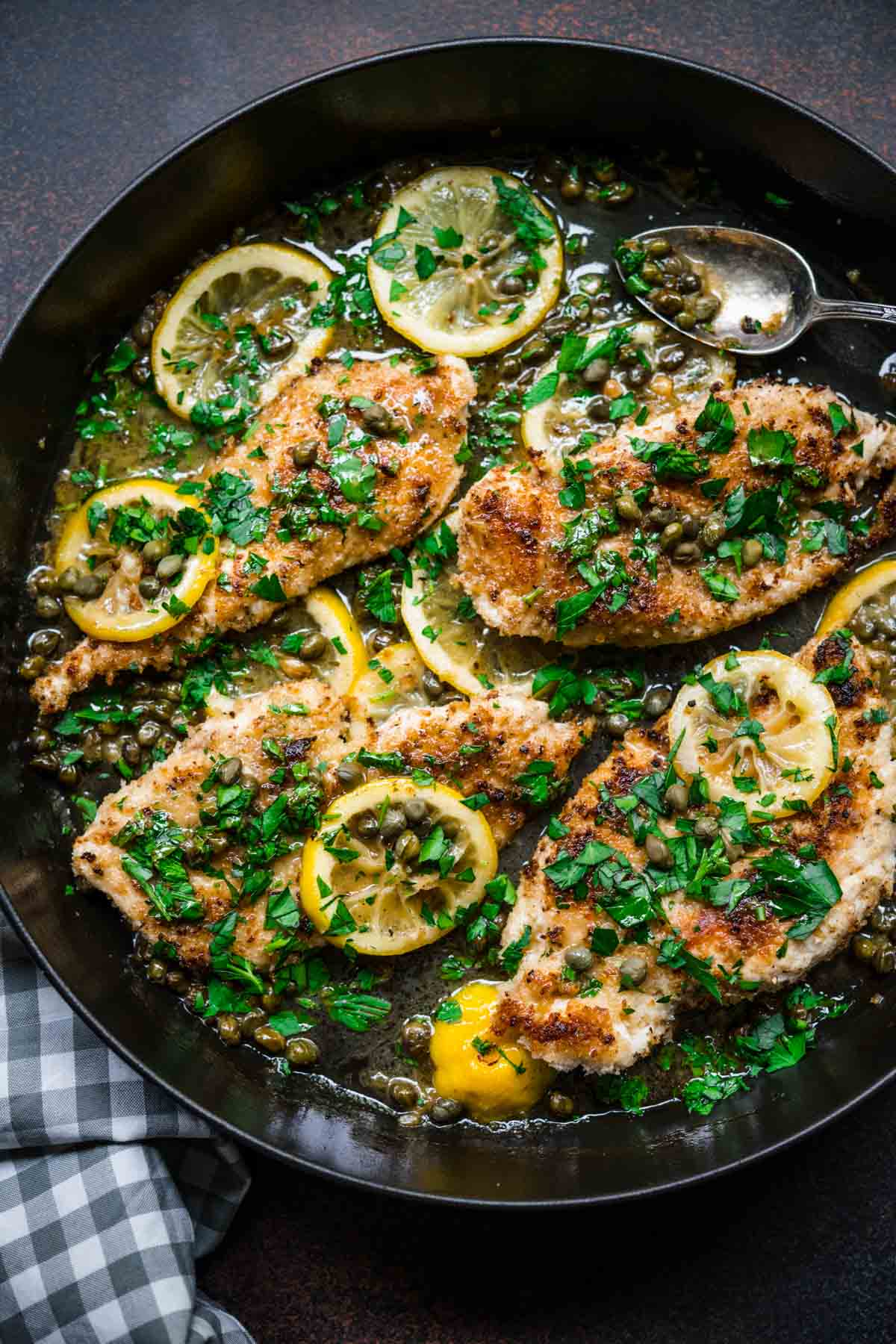 Chicken Piccata in pan with lemon and parsley