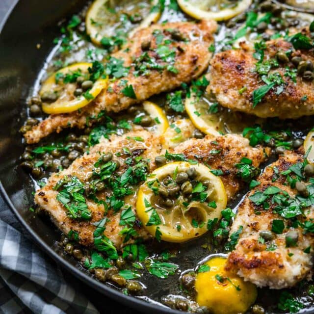 Chicken Piccata in pan with lemon and parsley