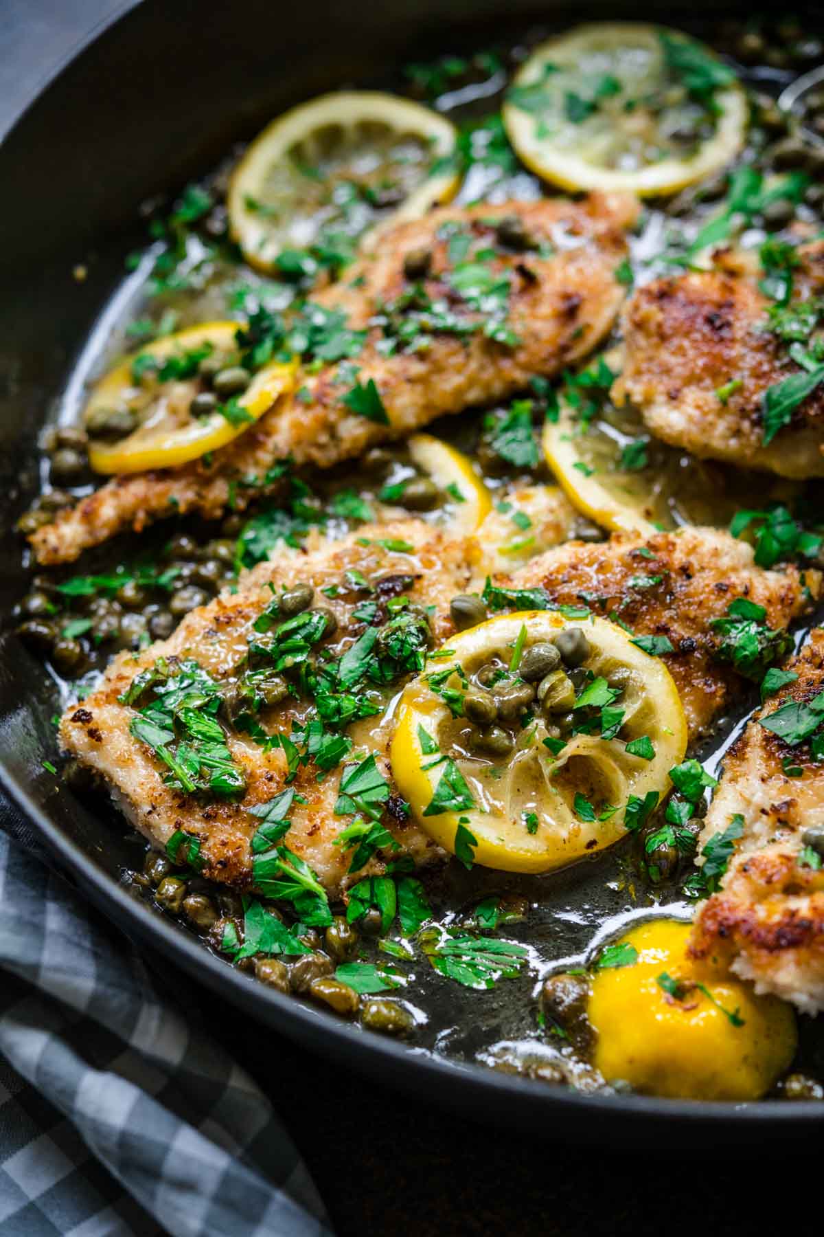 Chicken Piccata in pan with lemon and parsley