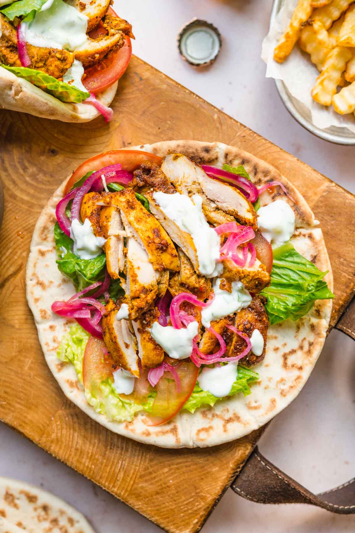 Chicken Shawarma on pita with tzatziki and pickles turnips