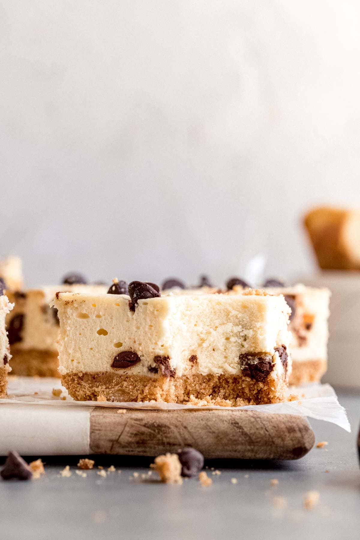 Close up of Chocolate Chip Cheesecake Bars on cutting board