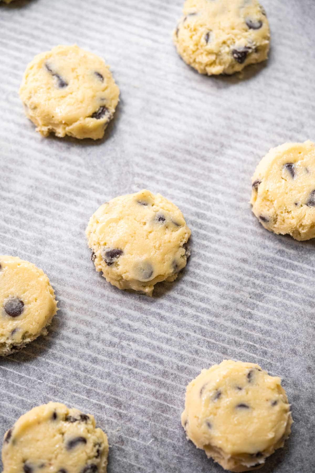 Close up of Cream Cheese Chocolate Chip Cookies dough on baking sheet