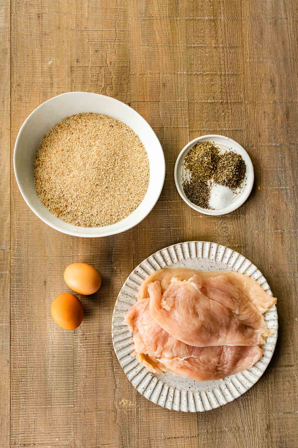 Crispy Breaded Chicken breading ingredients and chicken in bowls