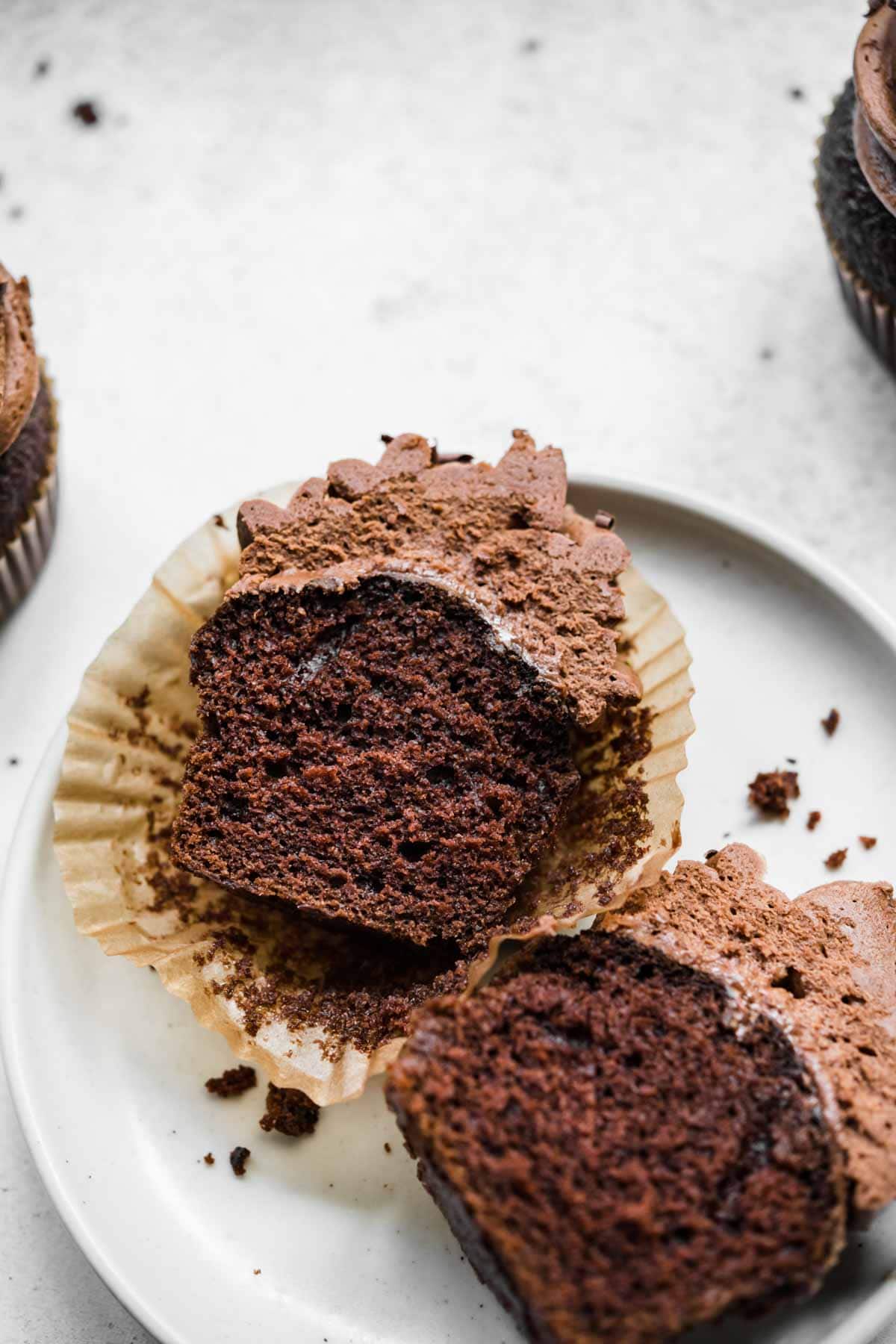 Dark Chocolate Cupcake sliced in half on plate