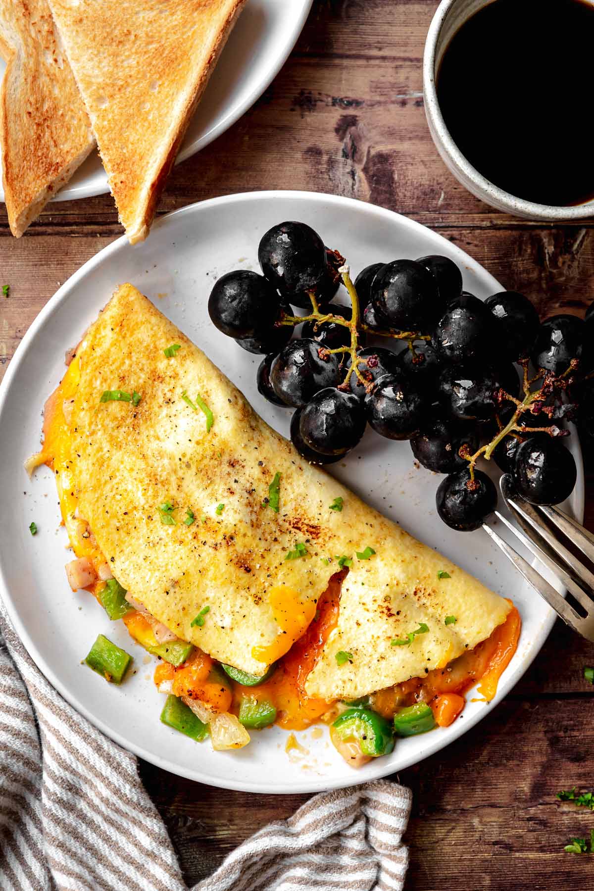 Denver Omelette on plate with black grapes