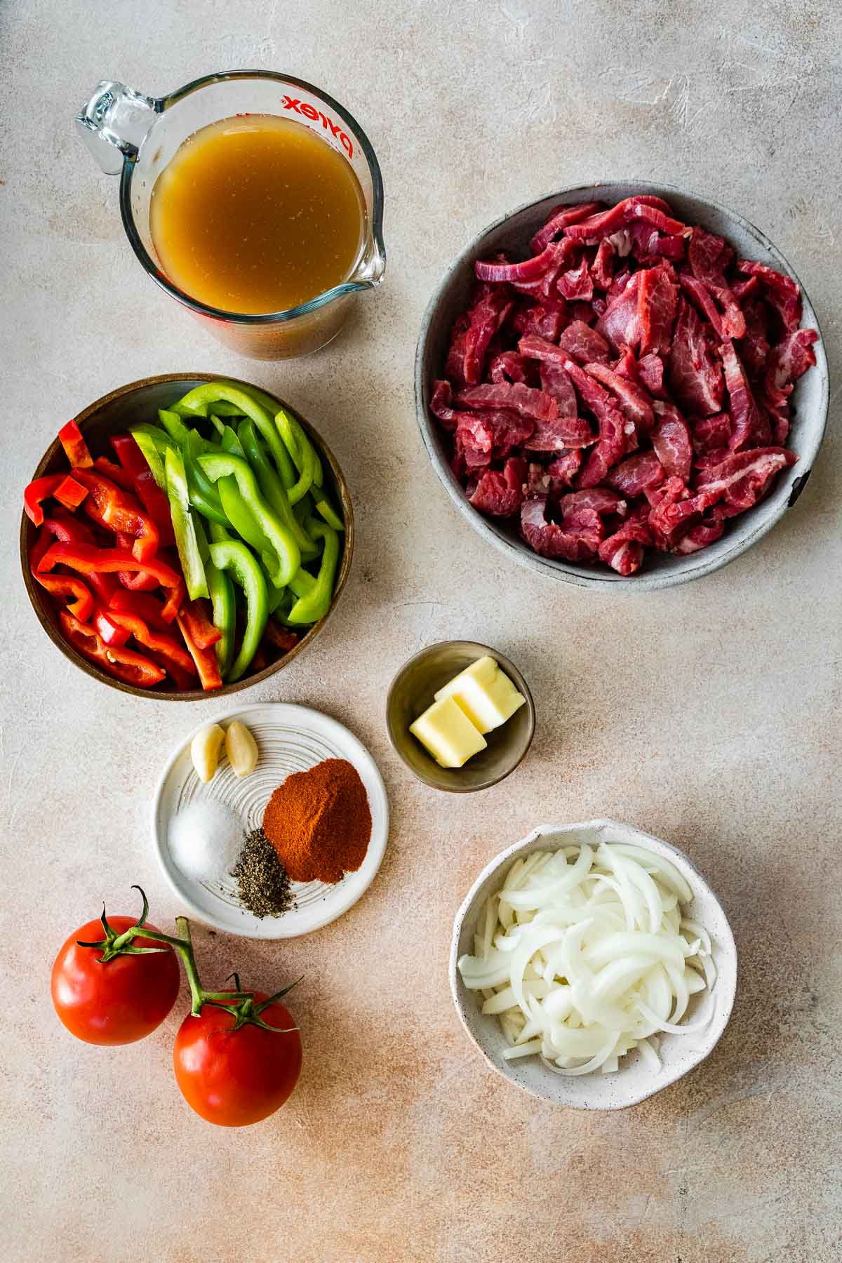 Easy Pepper Steak ingredients in prep bowls